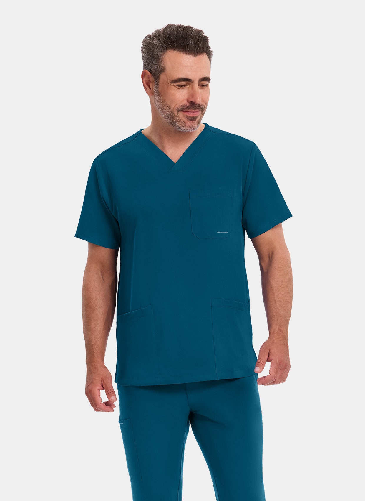 homme portant une blouse médicale Healing Hands Matthew bleu Caraïbe