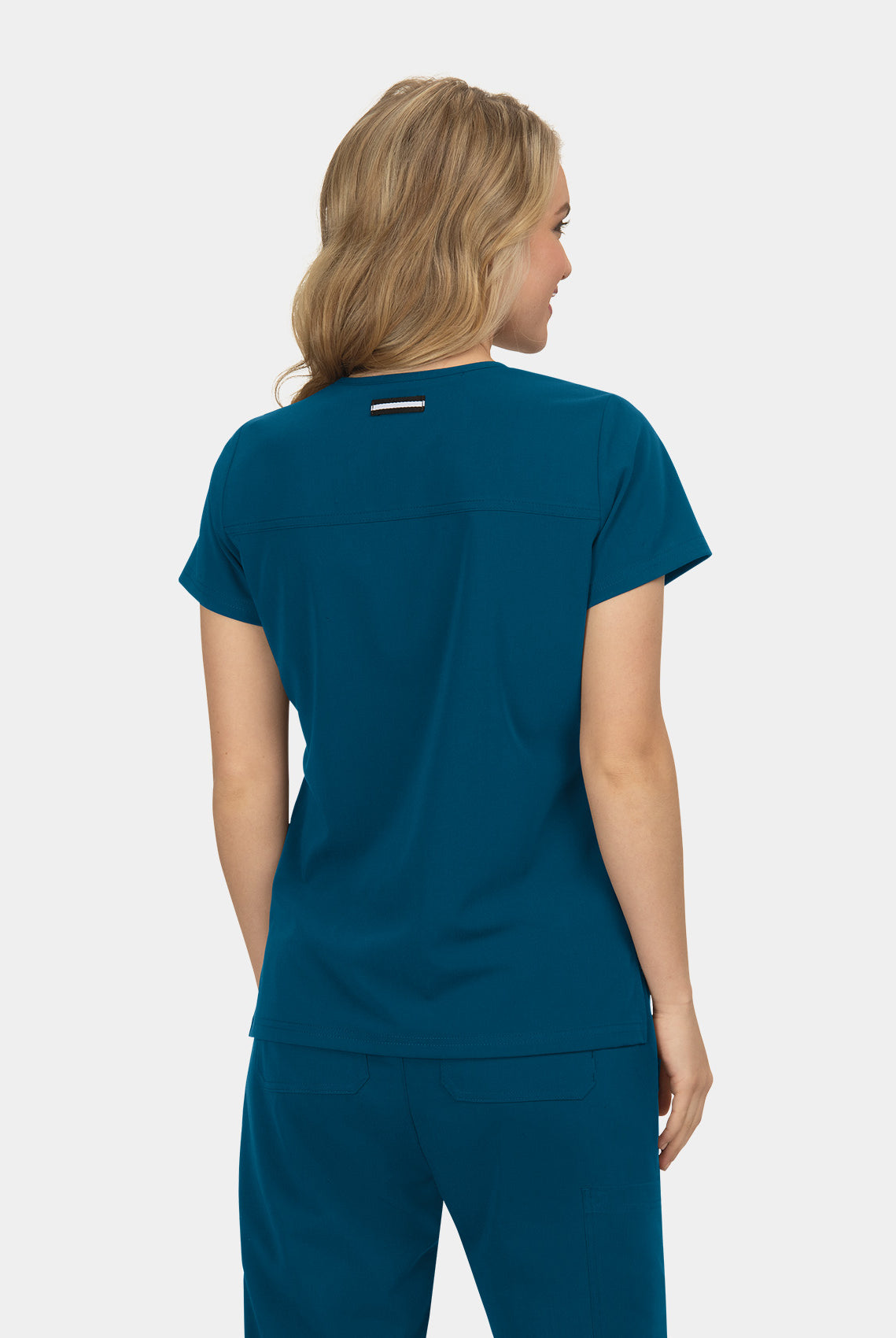 Blouse médicale femme Koi Next Gen Agitation et passion bleu caraibes dos