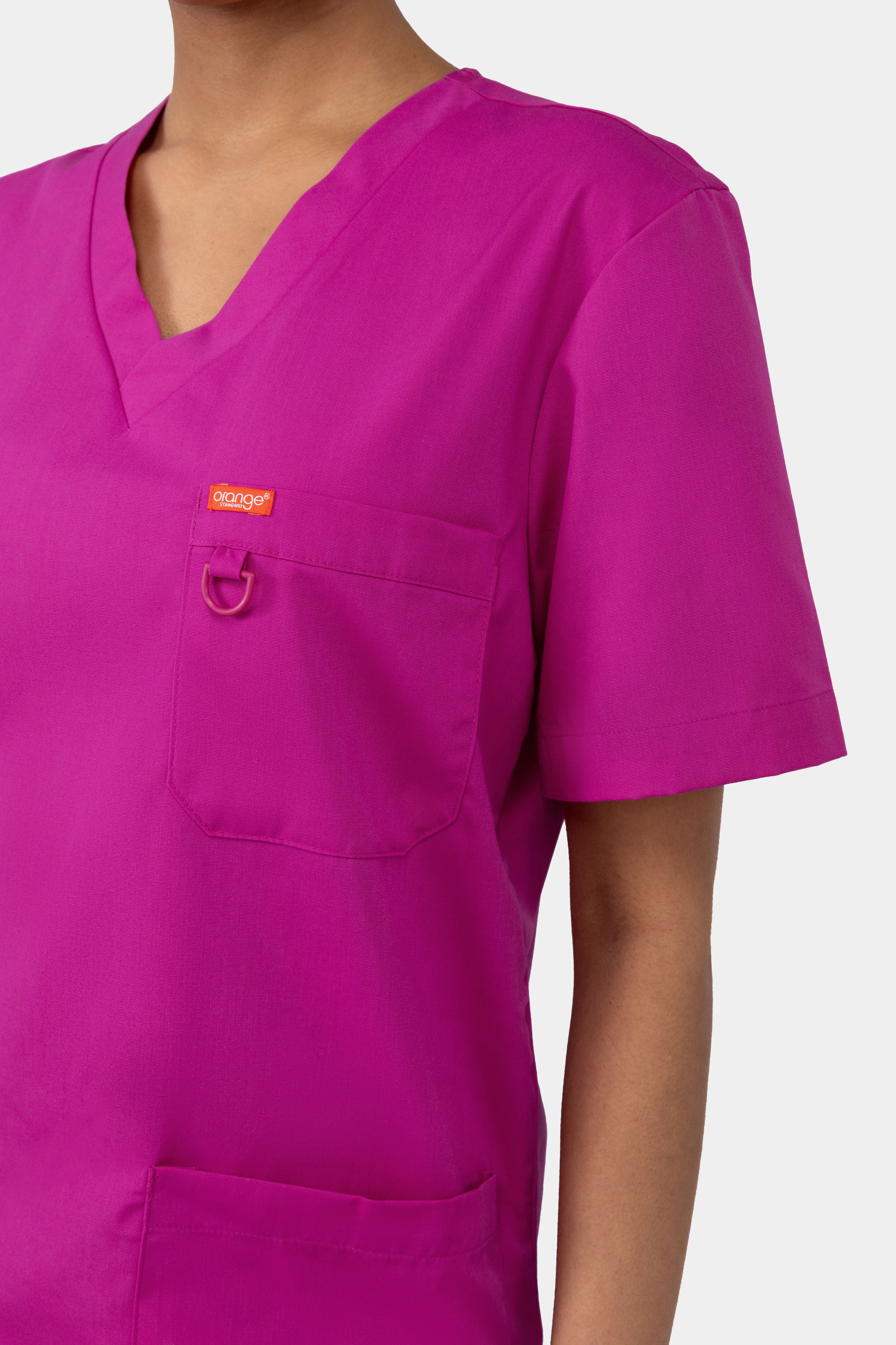 Focus d'une blouse médicale unisexe Balboa Orange Standard - Fierce Fuchsia