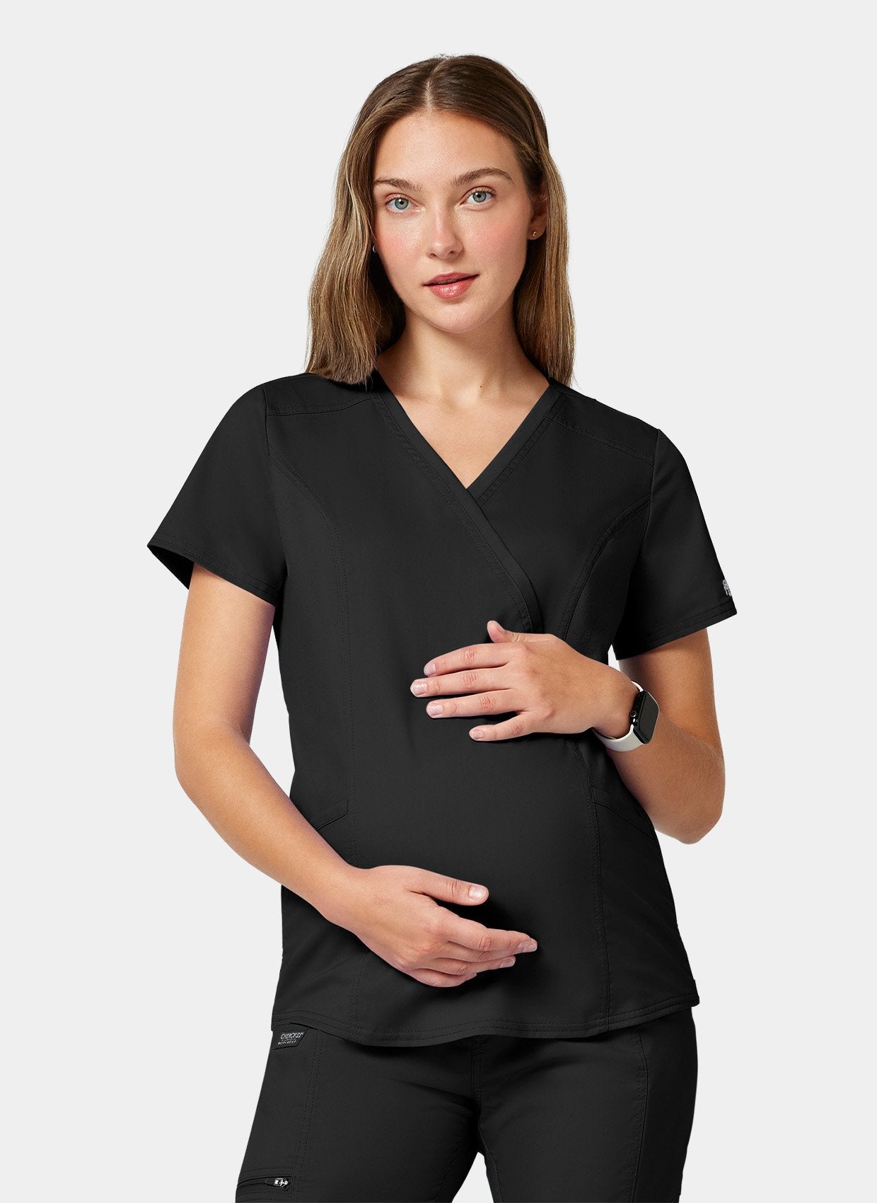 Blouse médicale noir femme face deux mains sur le ventre