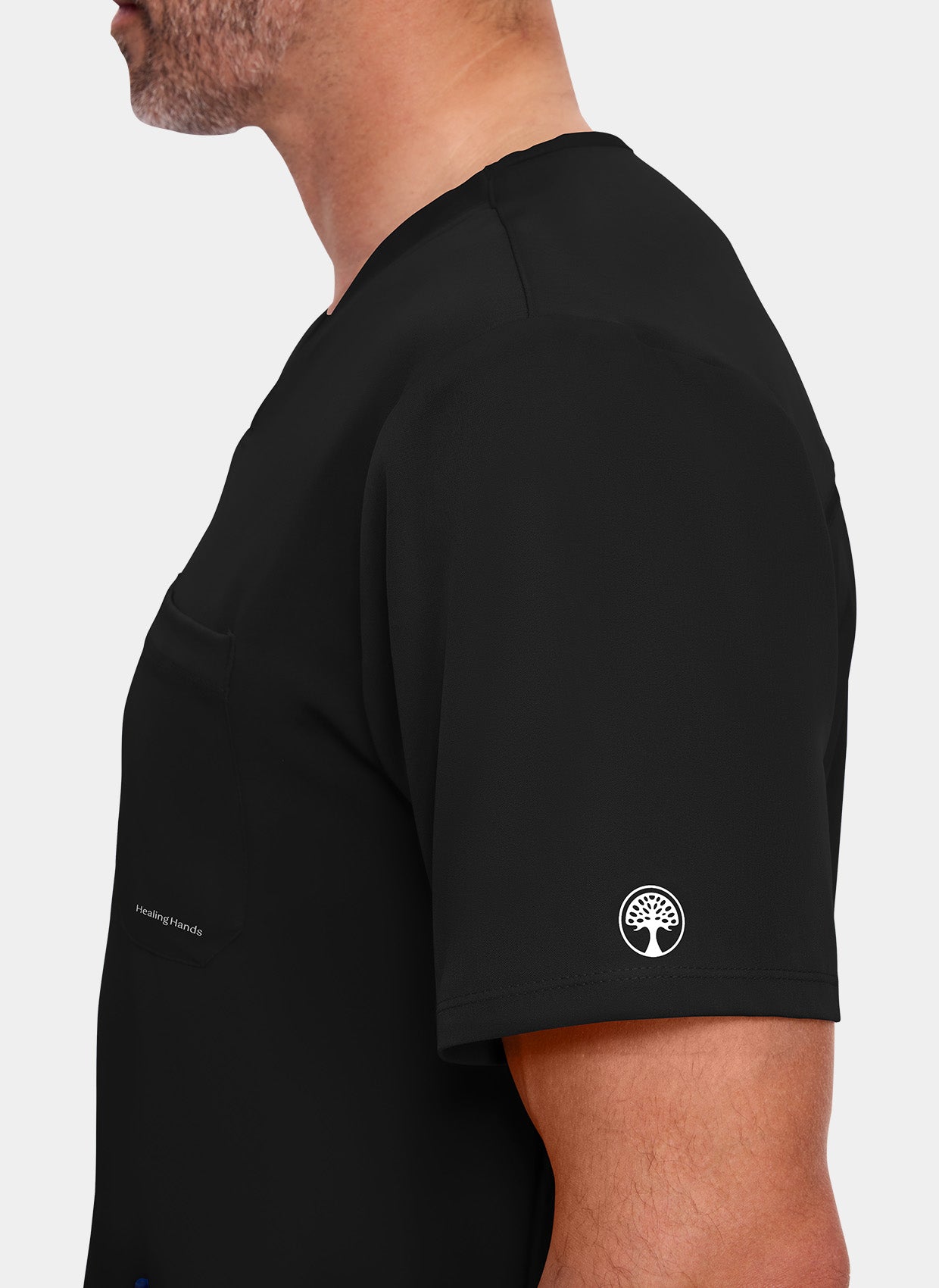 zoom sur manche d'un homme portant une blouse  médicale Healing Hands Matthew noire