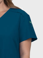 Blouse médicale femme Koi Cureology Cardi bleu caraibes poche