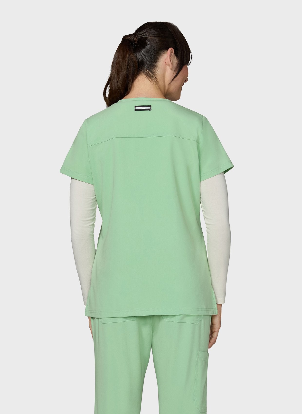 Blouse médicale femme Koi Next Gen Agitation et passion pistache dos